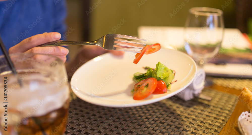 Dish with tomatoes and cucumbers in a restaurant Dish with tomatoes and cucumbers in a restaurant