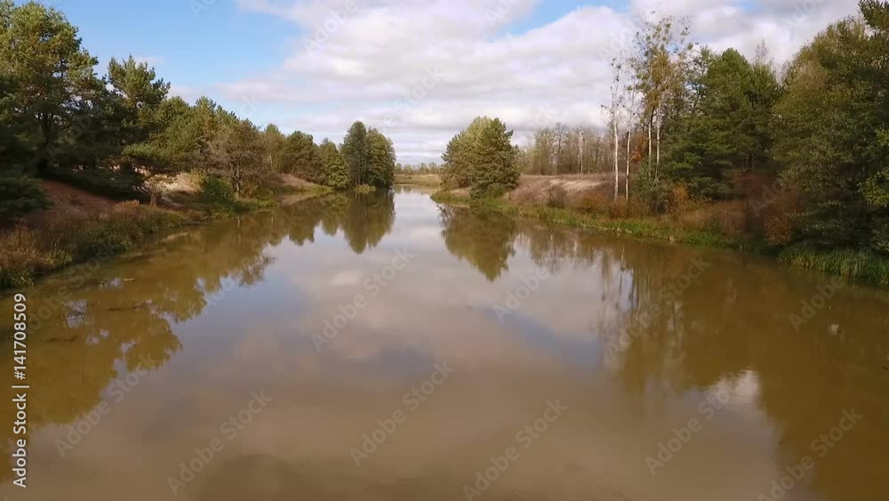 Aerial photography of the river flowing along the forest Aerial photography of the river flowing along the forest