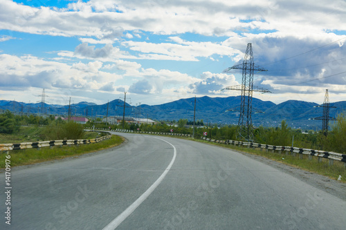 Mountain road. The landscape of fields and mountains