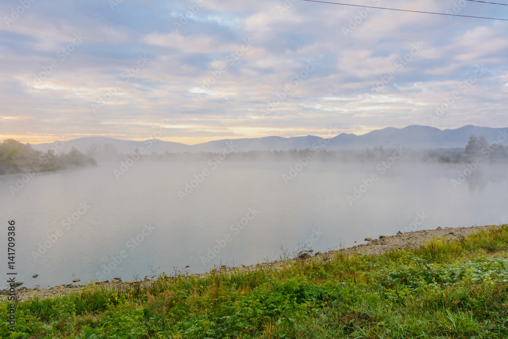Lake in the mountains for recreation and fishing. Early morning Lake in the mountains for recreation and fishing. Early morning