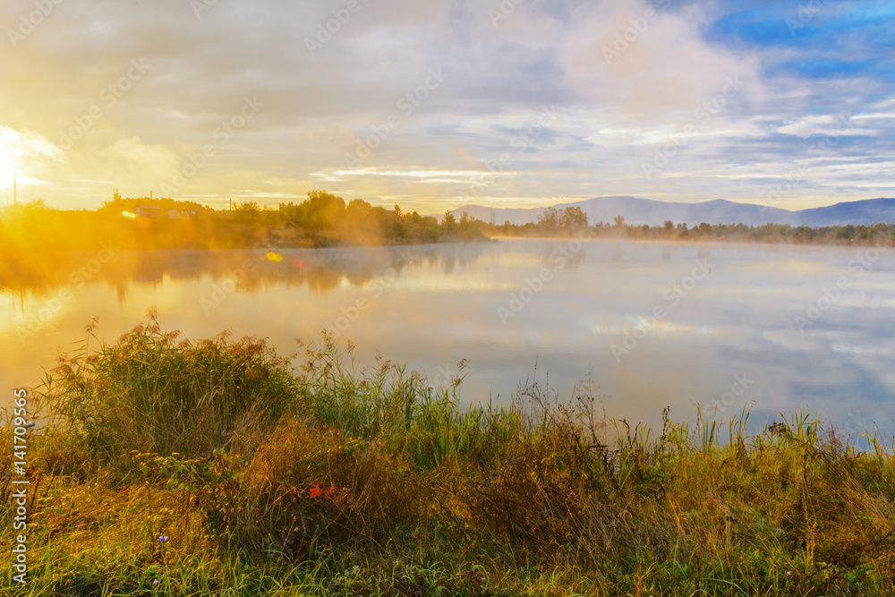 Lake in the mountains for recreation and fishing. Early morning Lake in the mountains for recreation and fishing. Early morning