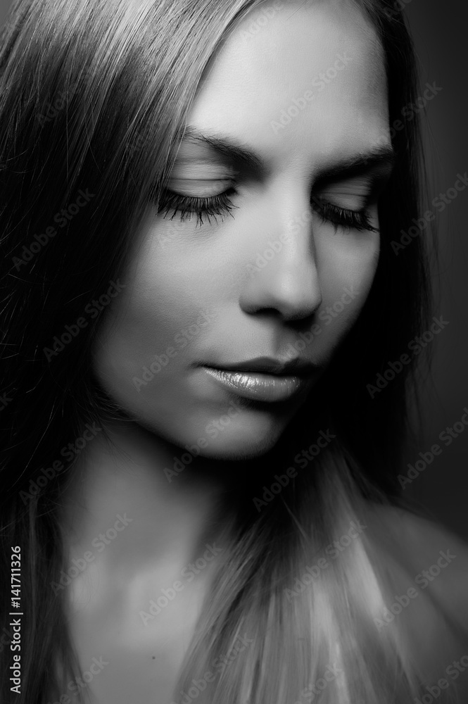 Black and white studio portrait of a cute girl Black and white studio portrait of a cute girl
