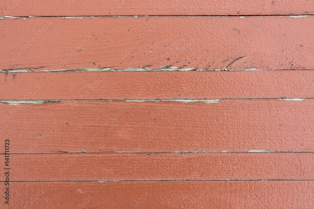 Red cracked painting on wooden surface Red cracked painting on wooden surface