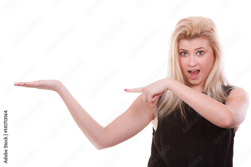Blonde woman pointing with hands at copyspace Blonde woman pointing with hands at copyspace