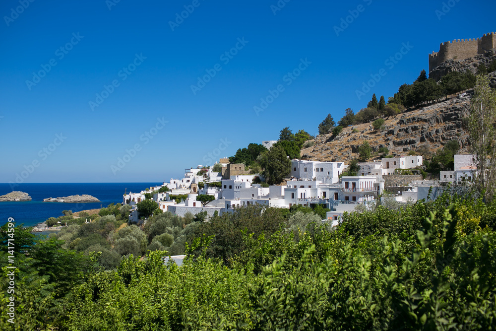 LINDOS, RHODES, GREECE: Famous white houses on a rock