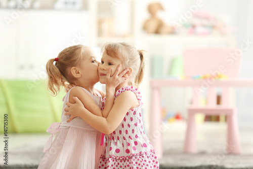 Adorable little girls in be...