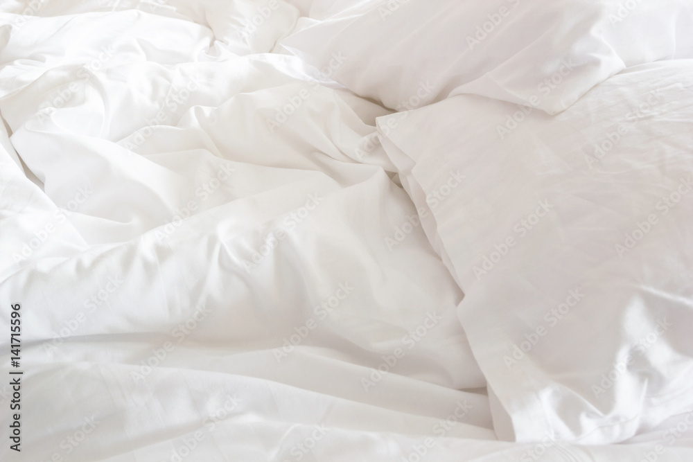 wrinkle messy blanket and white pillow in bedroom after waking up in the morning.