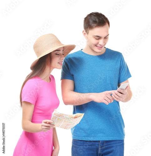 Young couple with guide map...