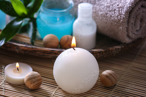 Candle and spa composition on background