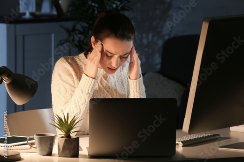 Tired woman working at night