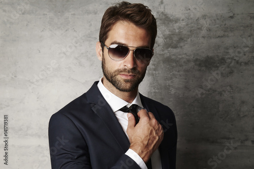 Businessman in shirt and tie and shades