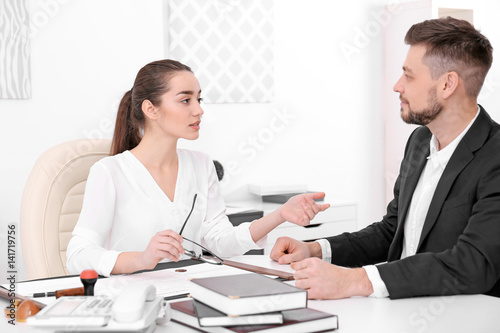 Young man at notary public ...