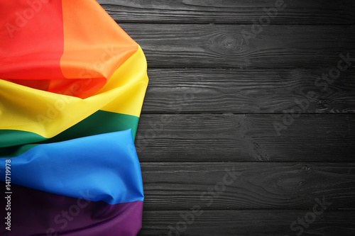 Fototapeta Rainbow gay flag on wooden background