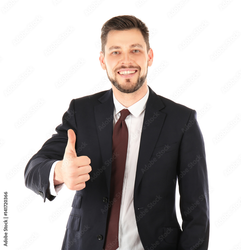 Handsome man in elegant suit showing thumb up on white background Handsome man in elegant suit showing thumb up on white background