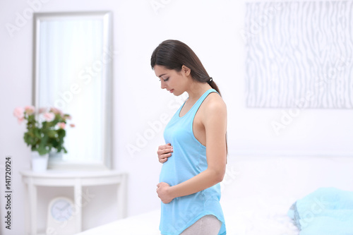 Beautiful pregnant woman to...