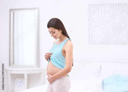 Beautiful pregnant woman to...