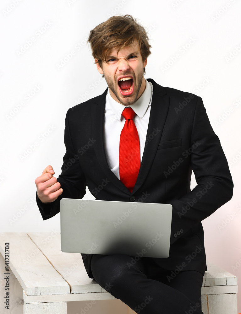 Caucasian stylish business man holding laptop Caucasian stylish business man holding laptop