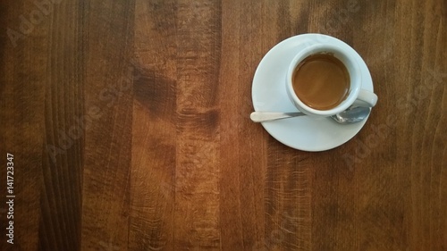 Cup of coffe on brown table