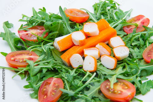 surimi with rocket and cherry tomatoes photo