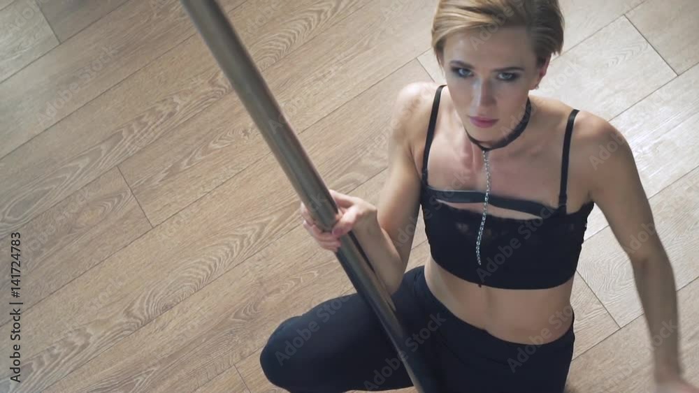 Girl dancing on a pole, dancer, fitness and sport. Pole Dance Girl dancing on a pole, dancer, fitness and sport. Pole Dance