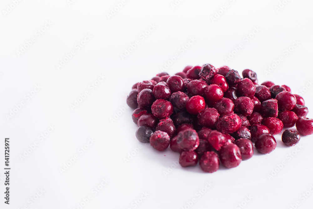 .Frozen cherries on a white background .Frozen cherries on a white background