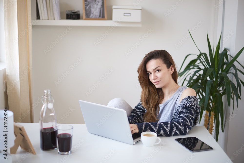 Young business girl in her personal workspace working Young business girl in her personal workspace working