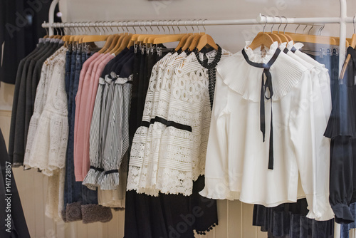 Women clothes on racks in a store in London.