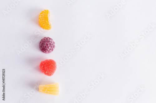 .Bright tasty marmalade on a white background