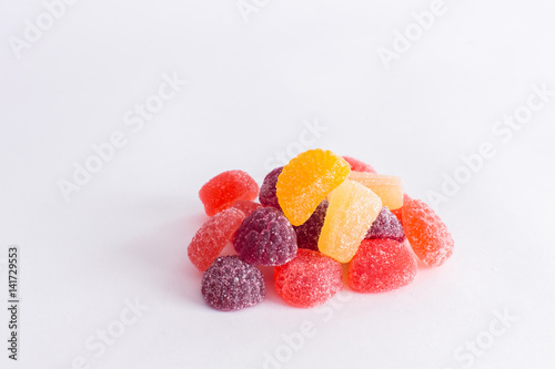 .Bright tasty marmalade on a white background