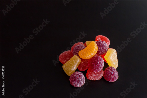 .Bright tasty marmalade on a white background