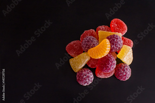.Bright tasty marmalade on a white background