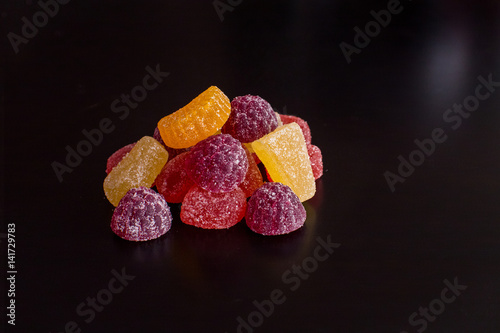.Bright tasty marmalade on a white background
