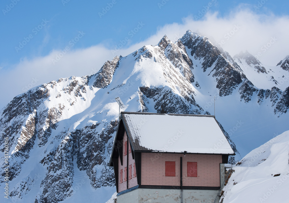 Snowy mountain hut in the Swiss alps