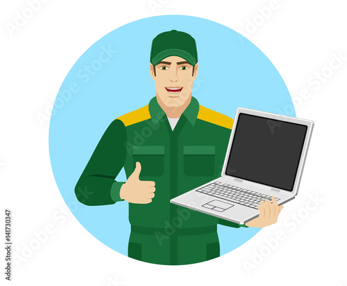 Worker holding laptop notebook and showing thumb up