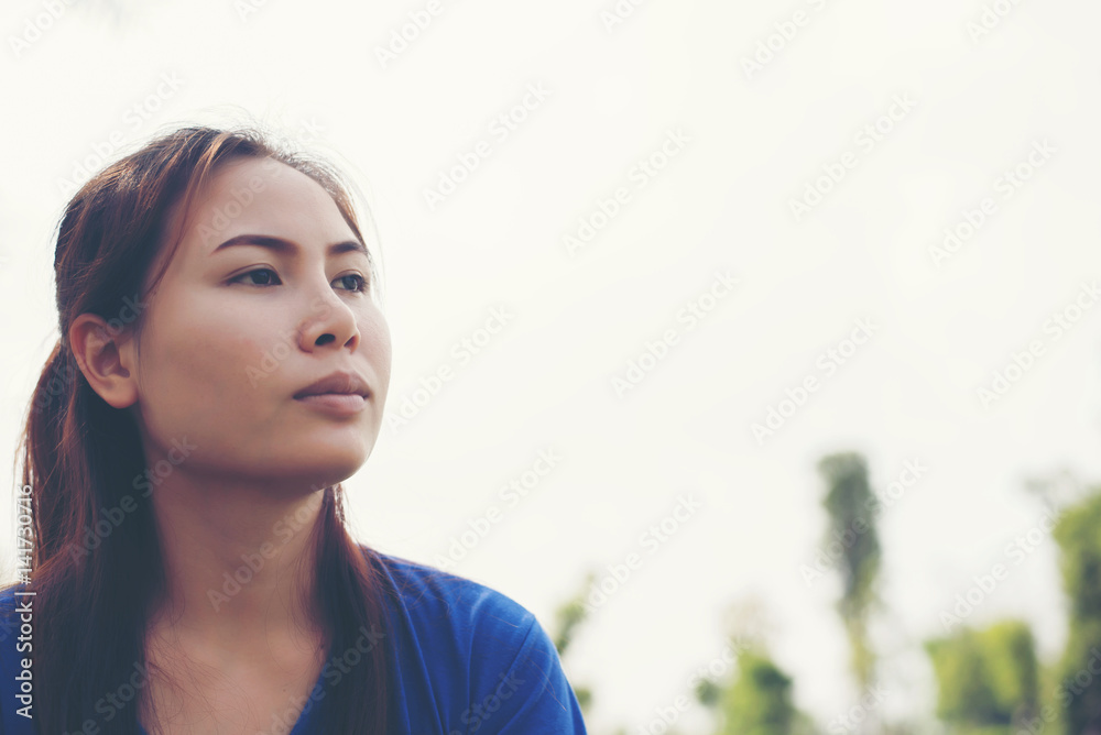 sad woman on the background of an the park sad woman on the background of an the park