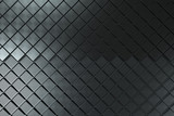 Futuristic industrial background made from black square metal shapes