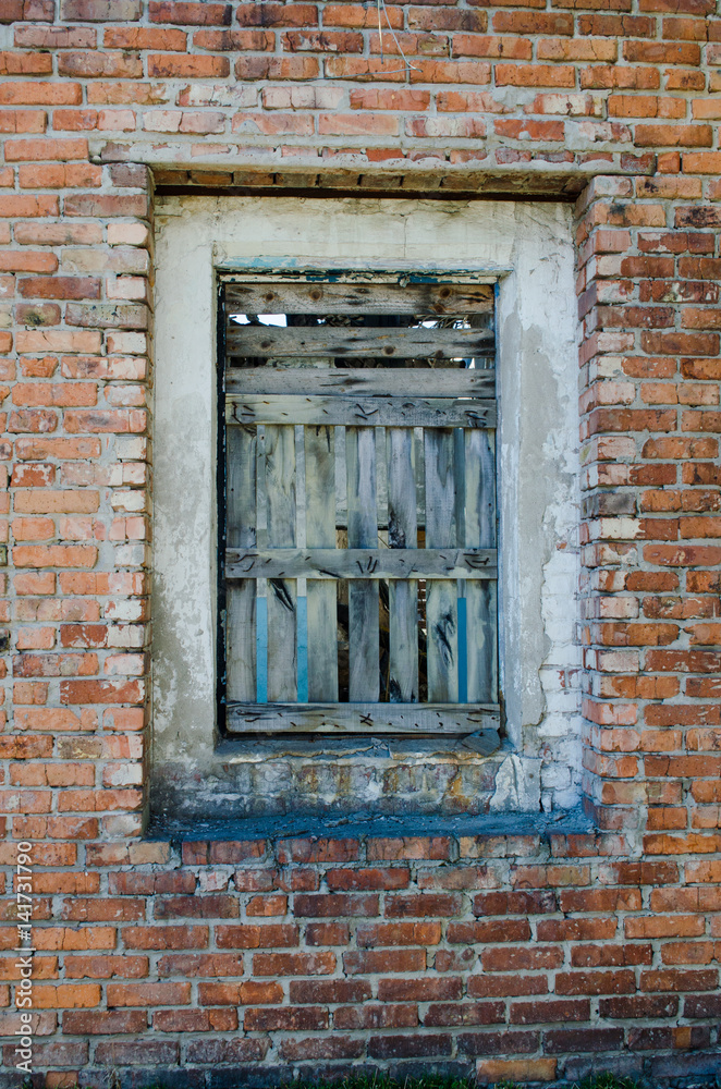 brick wall of old brick textured with an old window