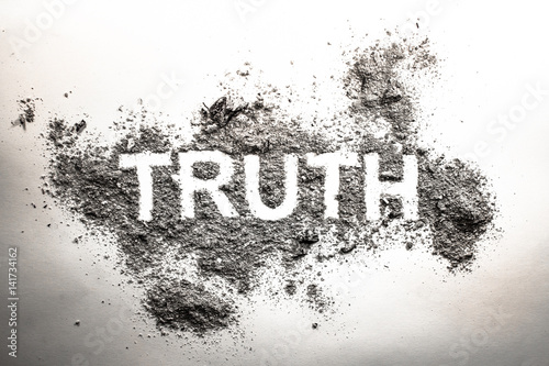 Truth word written in ash, dust, dirt or filth as a cynical concept of lie or post truth in society, politics photo