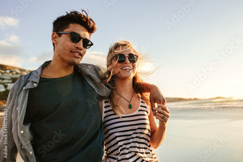 Young couple enjoying a summer day on seashore