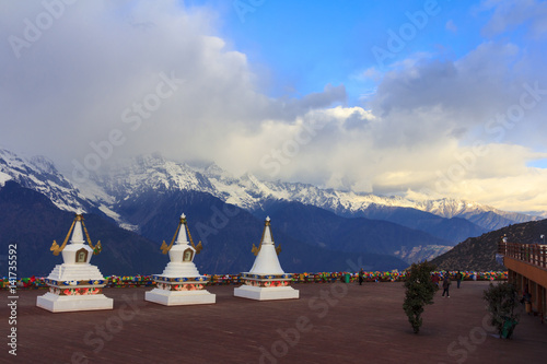 Meili snow mountain and Tibetan stupa, viewpoint from Feilai temple, Deqing, Yunnan, China
