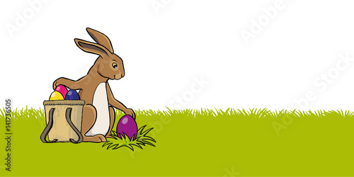 osterhase auf wiese mit tragkorb ei versteckend