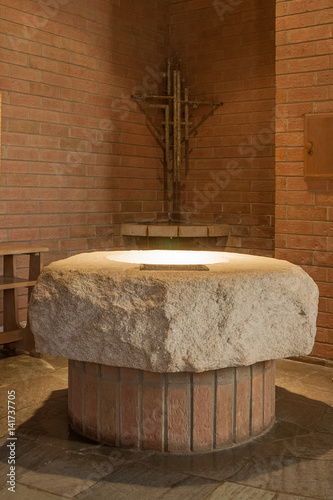 font in narthex with cross