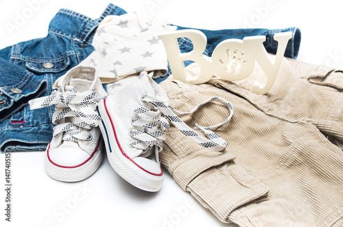 Set of baby clothes for a little boy on a white background.