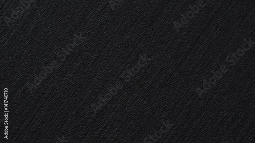 Black abstract metallic background, pattern of brushed metal texture