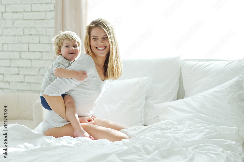 Woman with child at home Woman with child at home