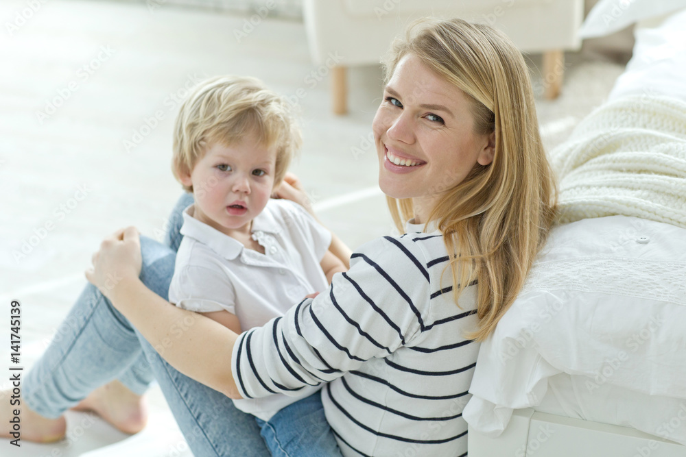 Woman with child at home Woman with child at home