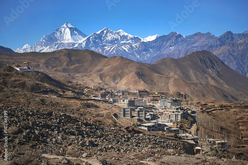 Ranipauwa (Muktinath) village with Dhaulagiri peak at the background in Himalayas, Nepal