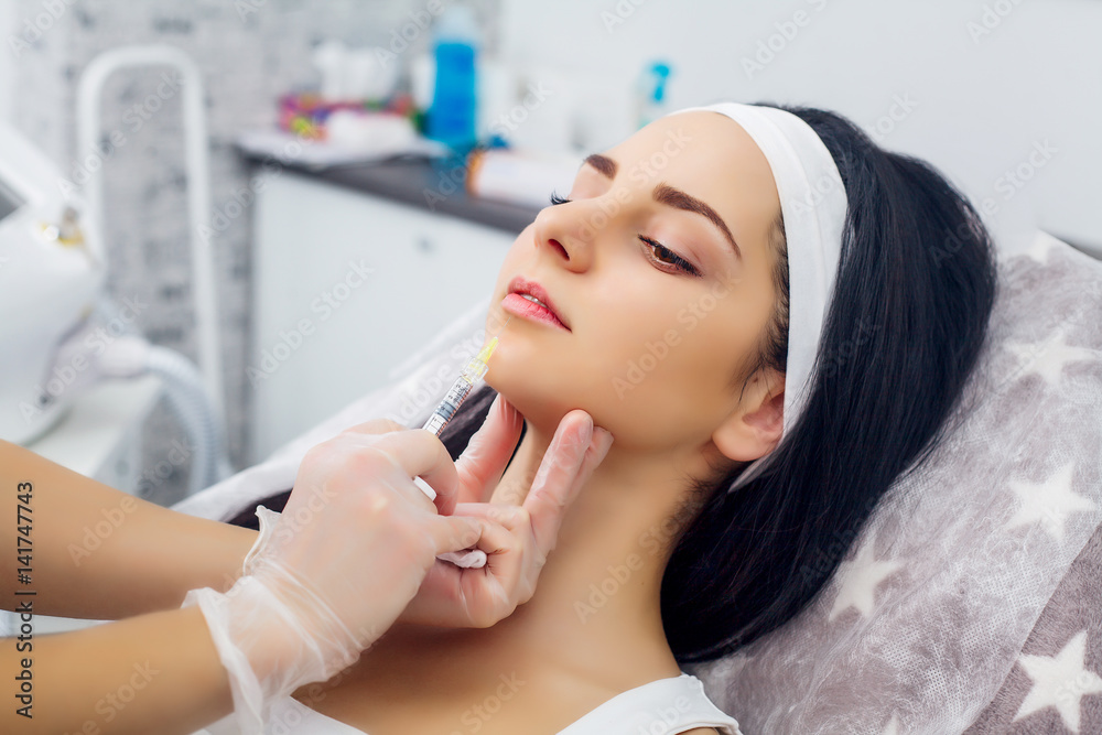 Beautiful woman gets injections. Cosmetology. Beauty Face Beautiful woman gets injections. Cosmetology. Beauty Face