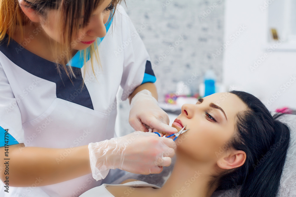 Cute girl receiving hyaluronic acid treatment Cute girl receiving hyaluronic acid treatment