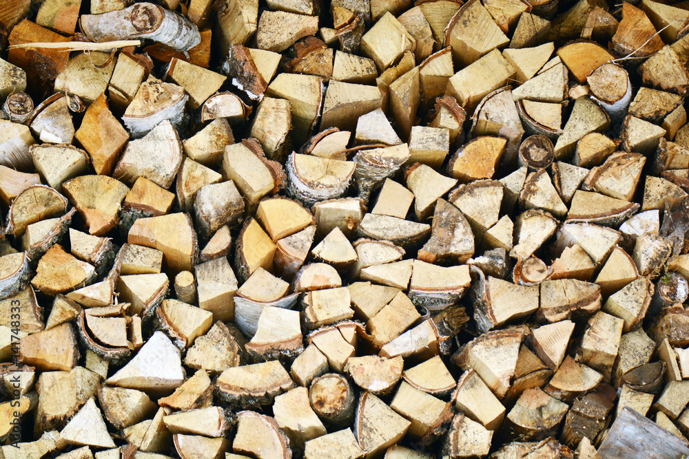 Natural wooden background, closeup of chopped firewood. Firewood stacked and prepared for winter Pile of wood logs. Chopped firewood on a stack. Natural wooden background, closeup of chopped firewood. Firewood stacked and prepared for winter Pile of wood logs. Chopped firewood on a stack.